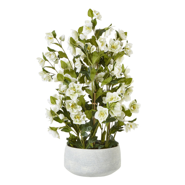 large white artificial hellebore in a grey pot