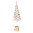 large white metal leaf Christmas tree on a wooden stand on white