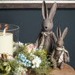 Bunny rabbit with candle and flowers, shown with a smaller rabbit sold separately