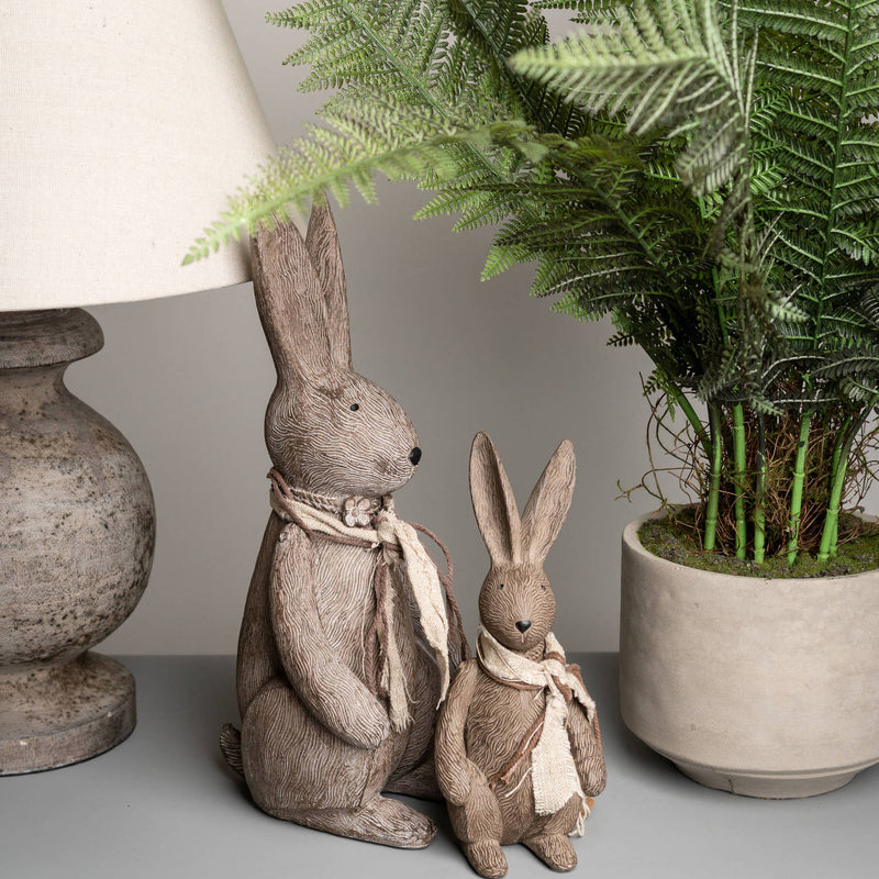 Bunny rabbit beside a lamp and fern, shown with a smaller rabbit sold separately
