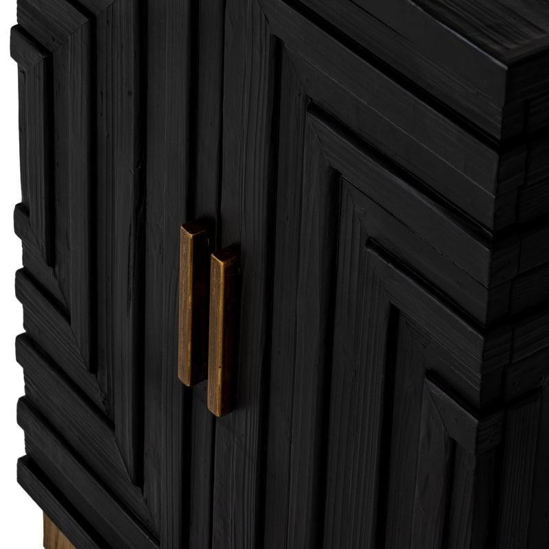 close-up of the carved doors and gold-tone handles