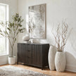 Lorenzo fin vases with branches beside a dark sideboard