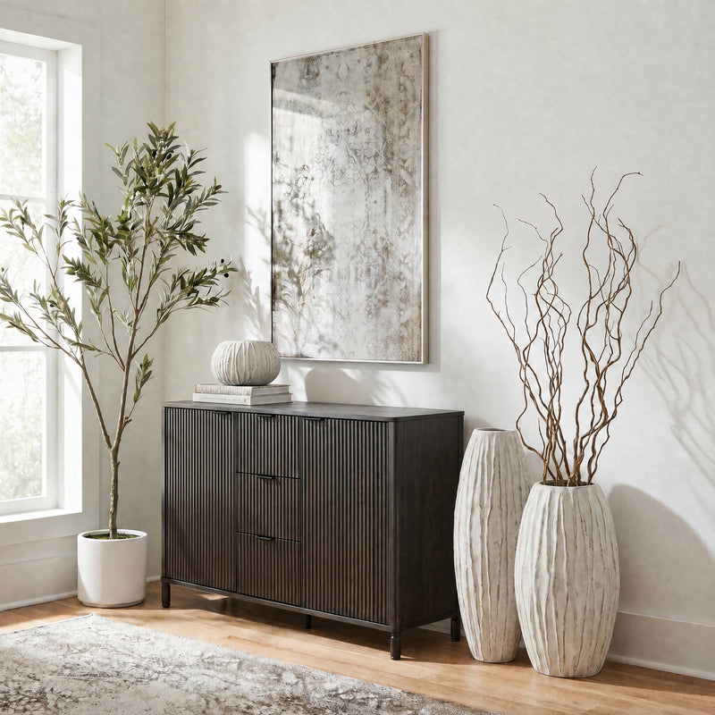 Lorenzo fin vases with branches beside a dark sideboard