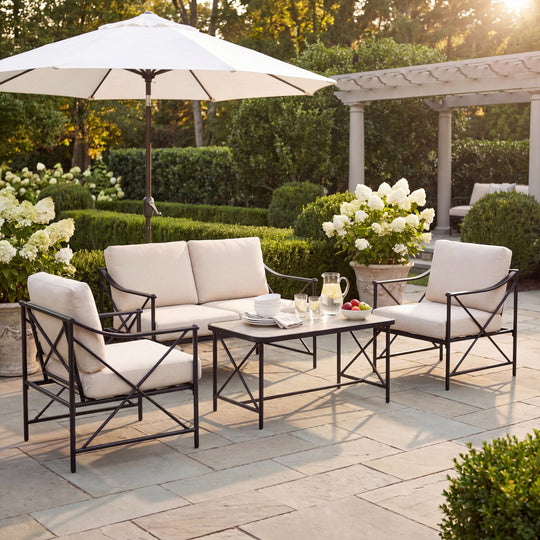 Madison lounge set under a parasol on a garden terrace