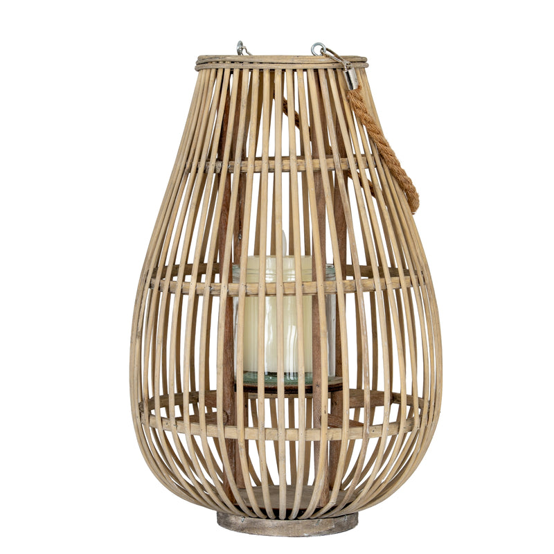 Medium ellipse wicker lantern with a candle in its glass holder