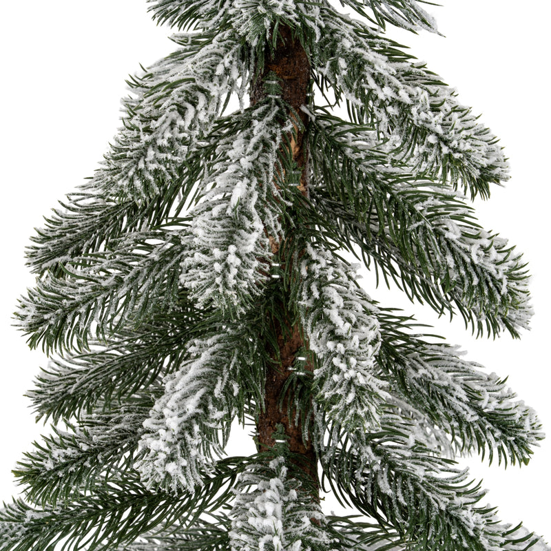 Close-up of the flocked snowy pine branches
