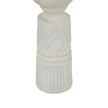 Close-up of the carved column and fluted base