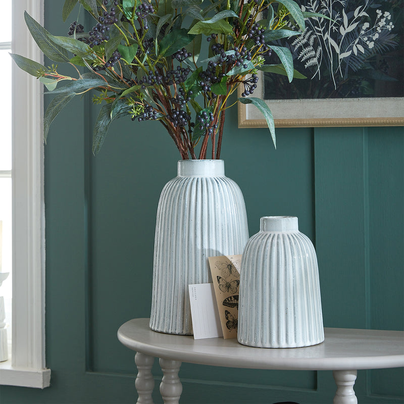Monte vases with greenery on a table, shown with a smaller size sold separately