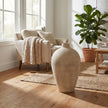 Morrow vase on a wooden floor in a living room