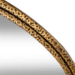 Angled close-up of the dimpled gold frame
