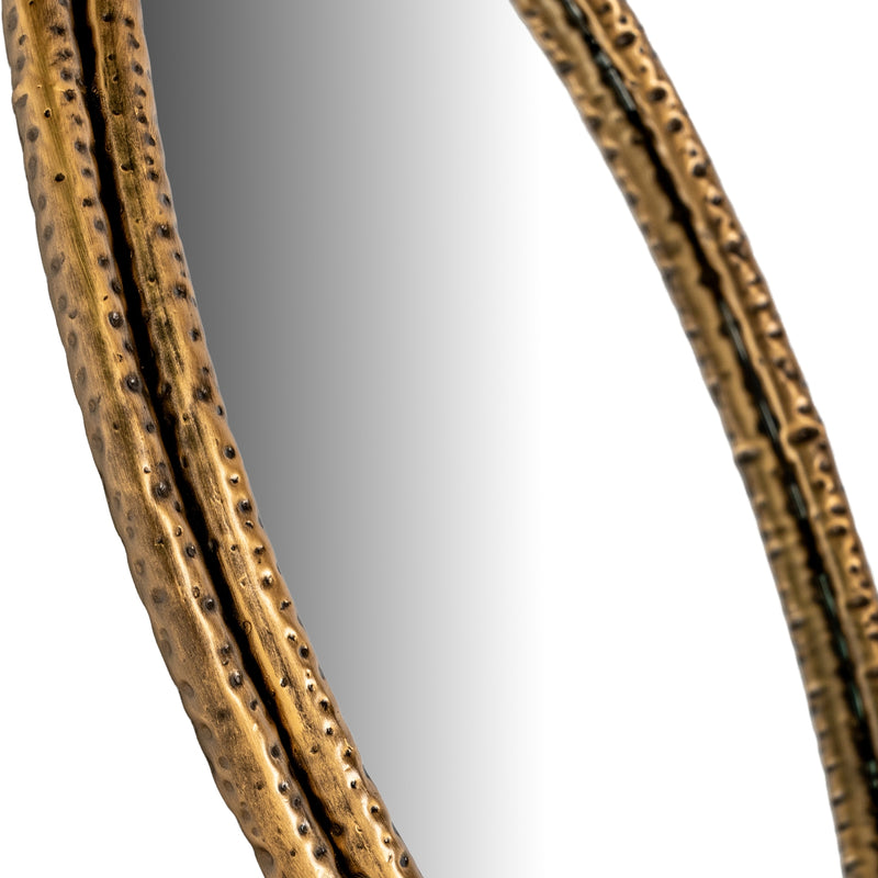 Close-up of the gold dimpled frame edge