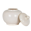 Neva jar with the lid set beside it, showing the opening