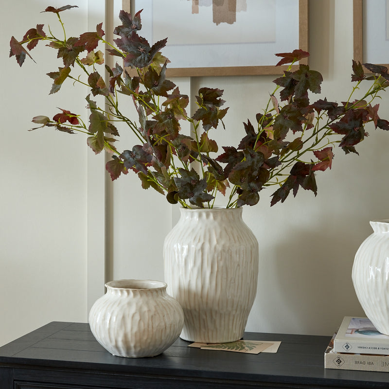 Numa vase with autumn stems on a sideboard, shown with other vases sold separately