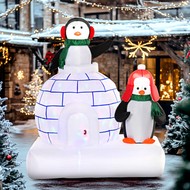 5ft Penguins and Igloo Christmas Inflatable displayed outside a decorated home
