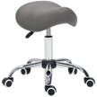 Grey faux leather saddle stool with hydraulic height adjustment and five wheels