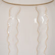 Close-up of the raised wavy lines on the cream glaze
