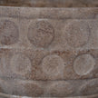 Close-up of the raised circle pattern and stone texture