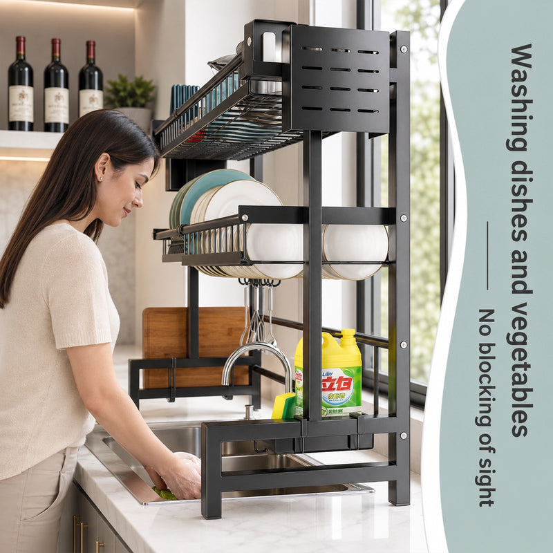 Woman washing dishes in a kitchen with a dish rack and cleaning supplies.