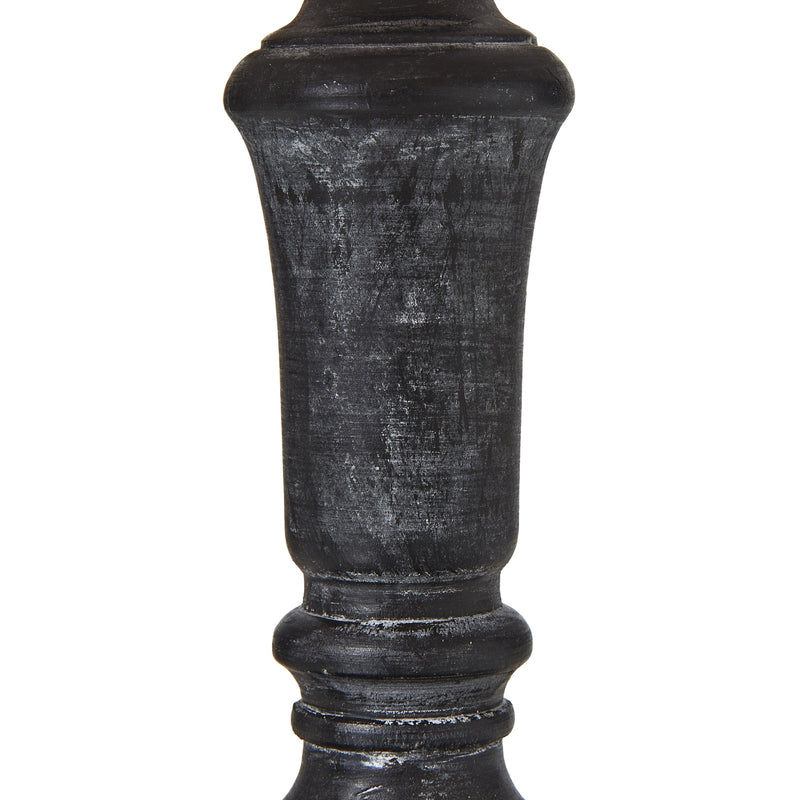Close-up of the turned black stem with worn highlights