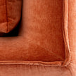 close-up of the stitched seam and textured orange fabric