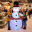 6.7ft Musical Snowman Christmas Inflatable in a festive outdoor setting