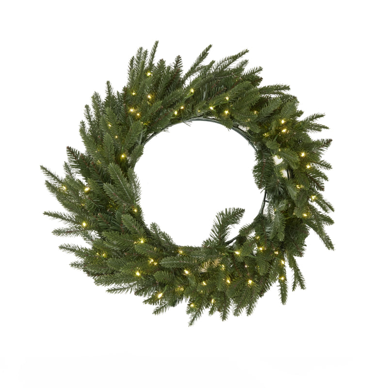 Pre-lit fir wreath with warm LED lights switched on