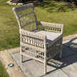 Provence Rattan-Effect Garden Dining Chair with Cushion, rattan-effect garden dining chair with cushion on a lawn