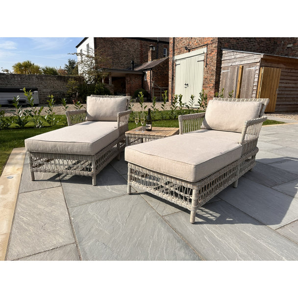 Provence rattan-effect sun loungers and acacia side table on a sunny patio