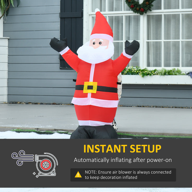 4ft Santa Christmas Inflatable shown inflating outside a home