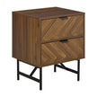 Walnut-effect bedside table with herringbone drawer fronts and black steel base