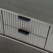 Close-up of the fluted drawer fronts and pulls