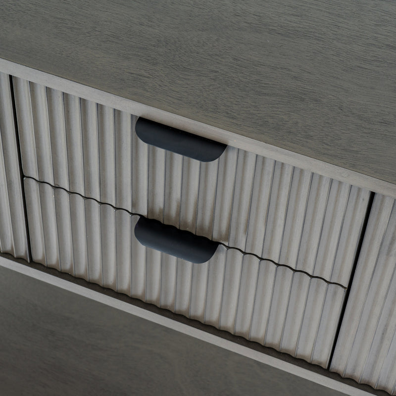 Close-up of the fluted drawer fronts and pulls
