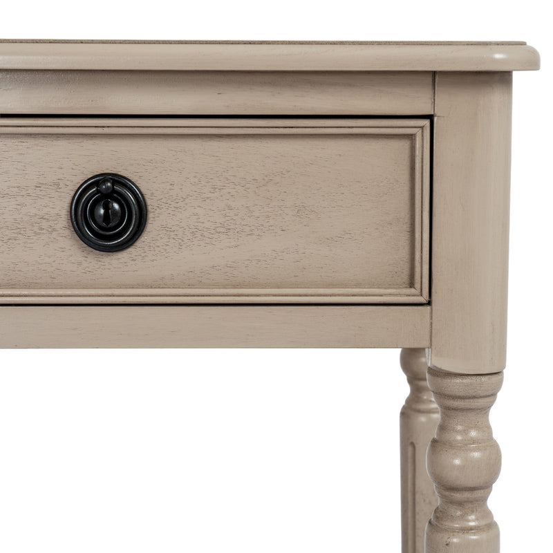Drawer front and turned leg close-up