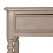 Close-up of the drawer front and turned leg