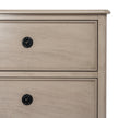 close-up of the panelled drawer fronts and black knobs
