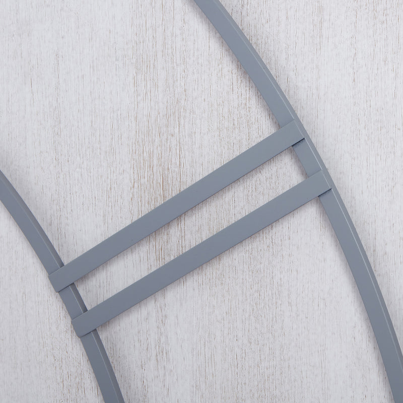 Close-up of the grey metalwork on whitewashed wood