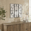 Roza panelled clock above a wooden sideboard