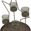 Close-up of the four glass votives on the round tray