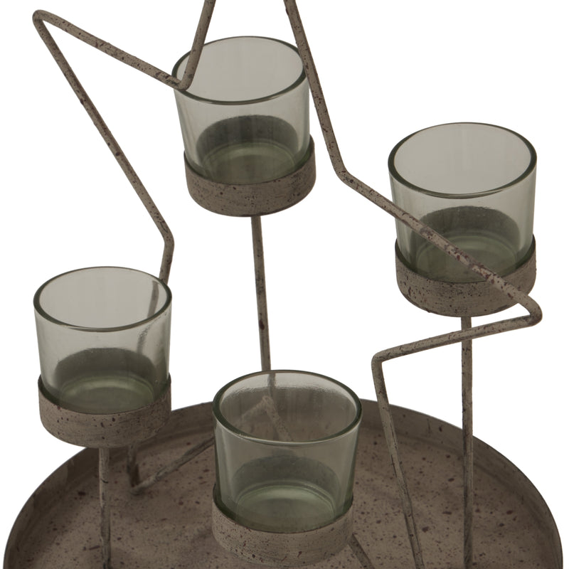 Close-up of the four glass votives on the round tray