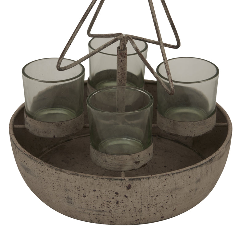 Close-up of the four glass votives in the rustic bowl
