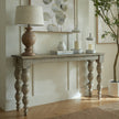 Rutland console styled with a lamp and vases