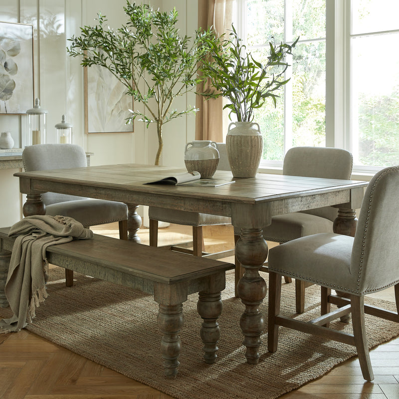 Rutland table with a bench and upholstered chairs, sold separately