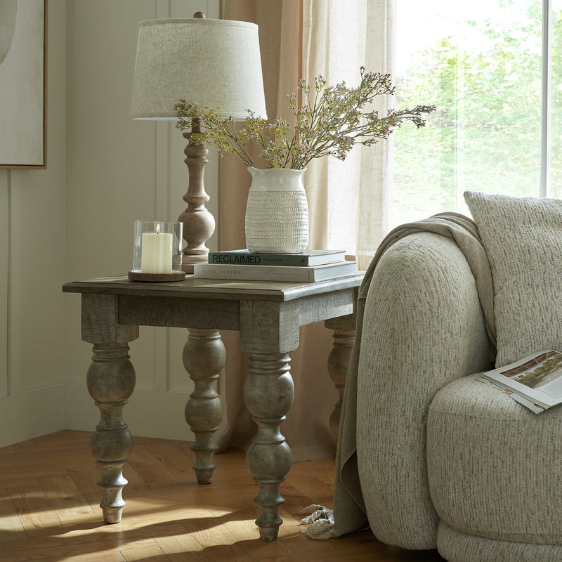 Rutland square side table beside a sofa with a lamp