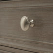 close-up of the round metal drawer knob