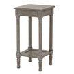 Serene grey side table with rattan shelf, three-quarter view