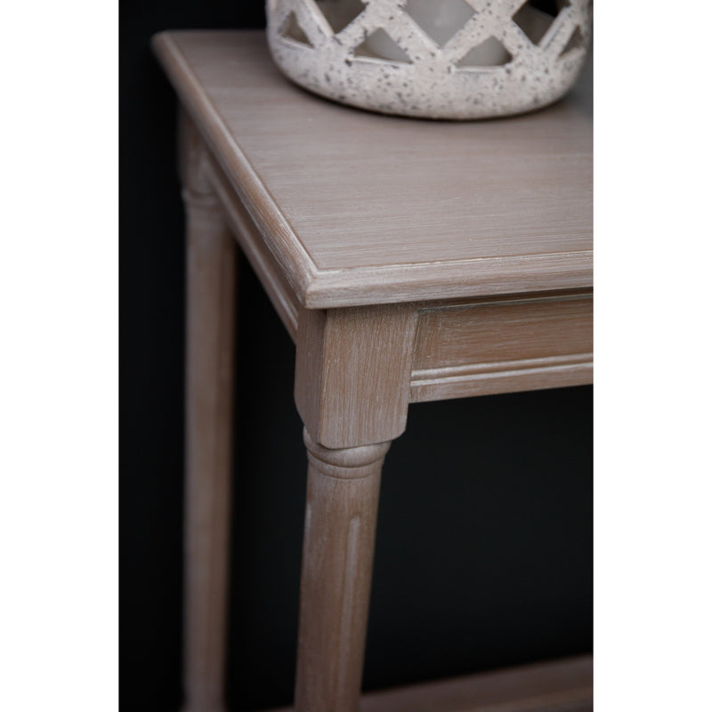 Corner of the grey console table top and turned leg