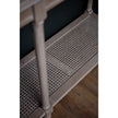 Woven rattan lower shelf of the grey console table