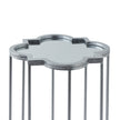 close-up of the quatrefoil mirrored top and silver frame