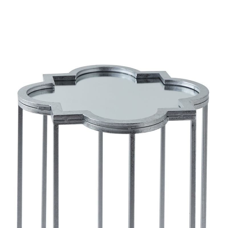 close-up of the quatrefoil mirrored top and silver frame