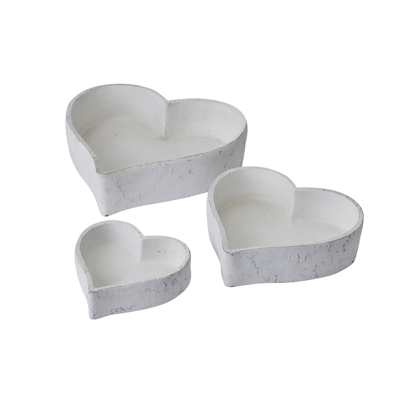 Three white heart dishes side by side